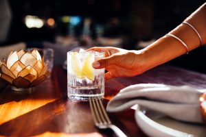 Wood Fire Grill drink in woman's hand